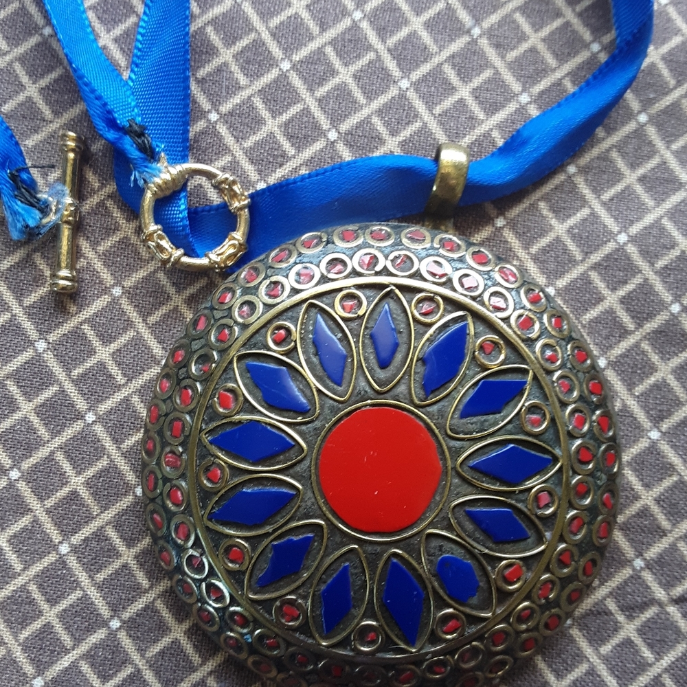 Boho brass inlay large pendant on a satin cord.